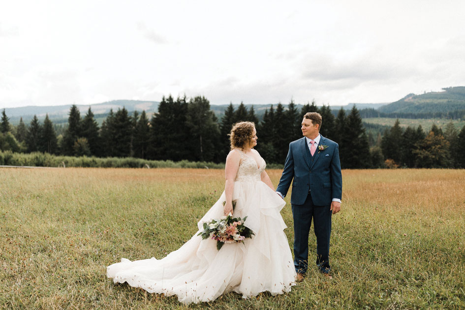 The bride's wild bouquet from Lucy's Informal Flowers fits the Mt. View Orchard scenery