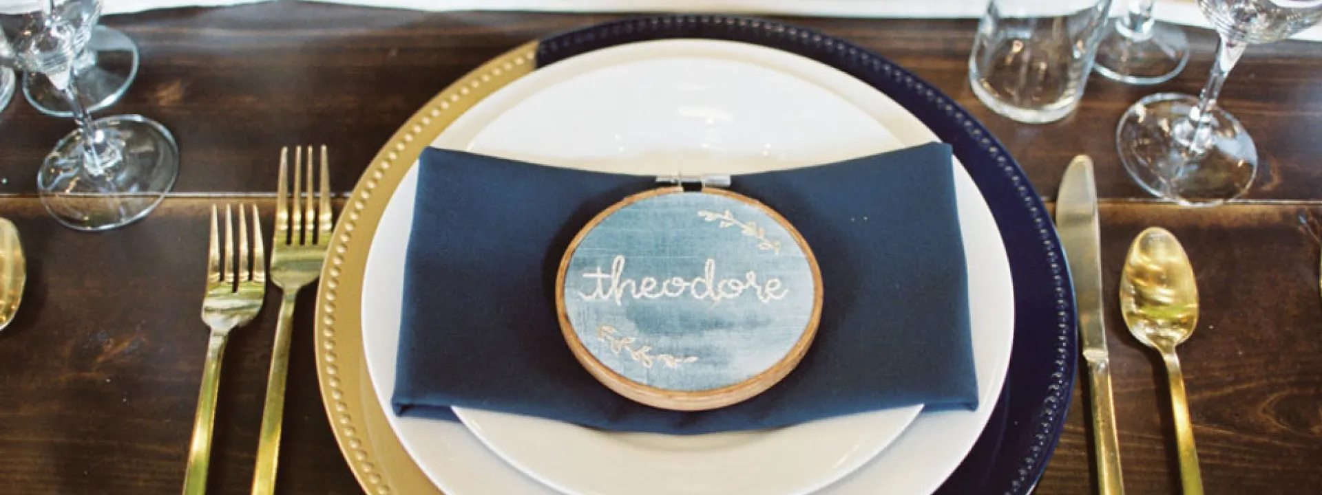Beautiful needlework serves as place cards at the reception 